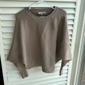 Batwing Philosophy sweater with gold button detail.